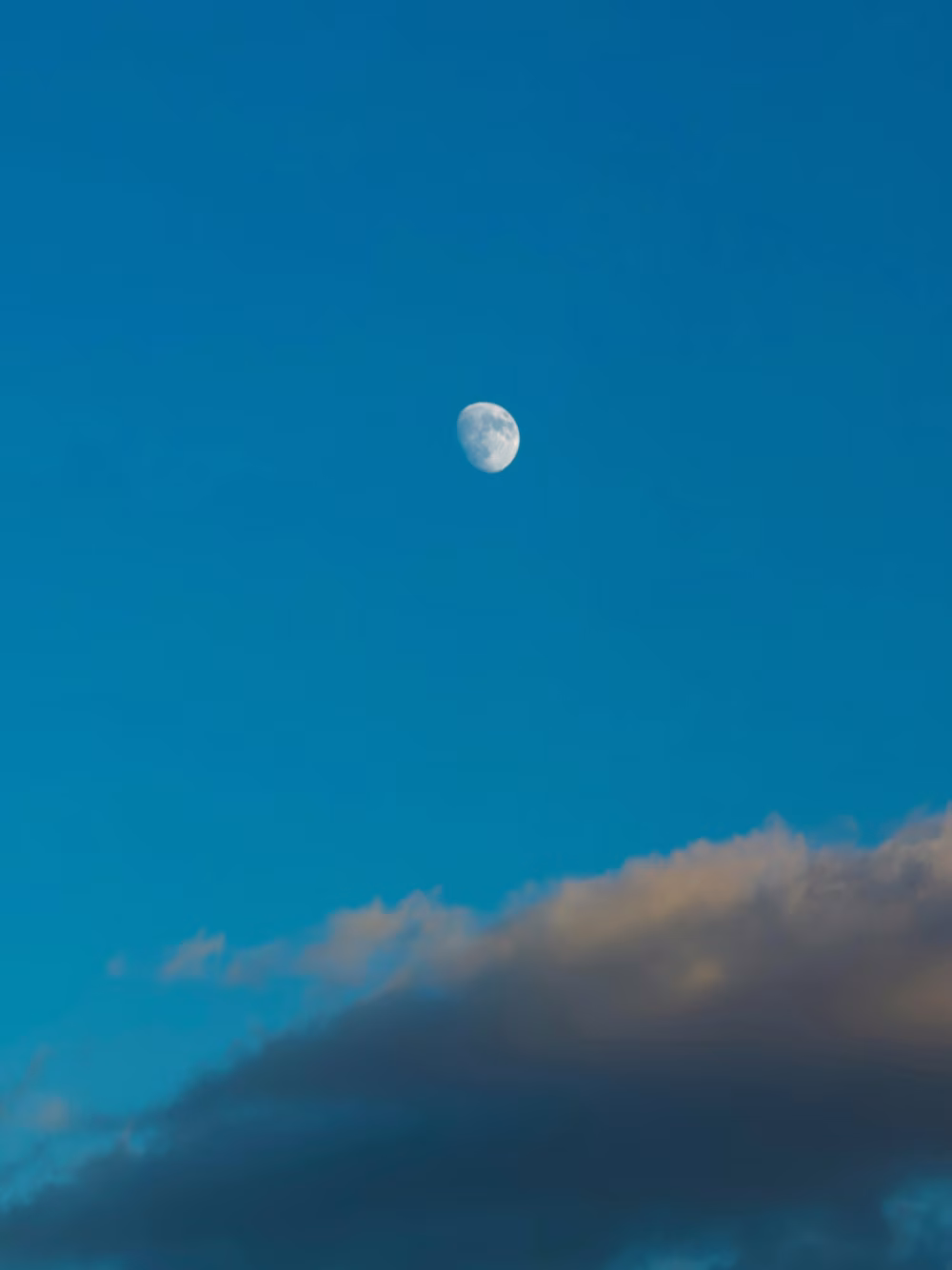 Daytime Moon Over Blue Sky With Soft Clouds — Calm Lunar Daylight and Tranquil Cloudscape