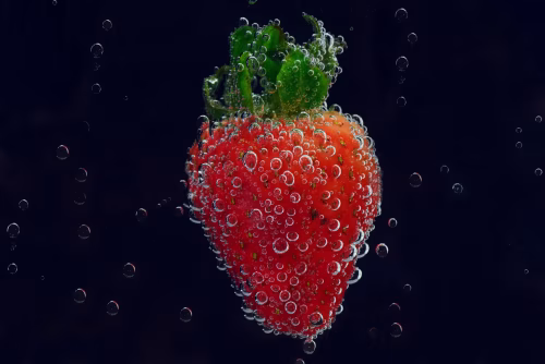 Sparkling Strawberry With Bubbles Underwater On Black Background — Macro Fruit Close-Up